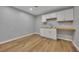 Basement area with white cabinets, wood countertops, and durable wood-look flooring at 501 Woodland Trce, Woodstock, GA 30189