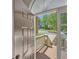 View from the open front door, looking out on the front steps and surrounding landscape on a clear day at 501 Woodland Trce, Woodstock, GA 30189