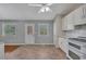 Well-lit kitchen with tile flooring features a double oven, view to the yard, and eat-in dining area at 501 Woodland Trce, Woodstock, GA 30189