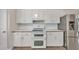 Charming kitchen featuring white cabinetry, laminate counters, and a stainless steel refrigerator at 501 Woodland Trce, Woodstock, GA 30189
