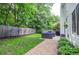 A well-manicured lawn with patio furniture and a beautiful garden at 521 Mirramont Pl, Woodstock, GA 30189
