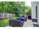 Outdoor patio with firepit and seating for a great backyard experience at 521 Mirramont Pl, Woodstock, GA 30189