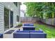 Comfortable patio with modern blue outdoor furniture and view of backyard at 521 Mirramont Pl, Woodstock, GA 30189
