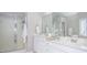 Bathroom featuring double vanity, frameless shower, and neutral paint at 521 Mirramont Pl, Woodstock, GA 30189