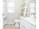 Clean, well-lit bathroom featuring a modern sink, vanity, and a shower with a stylish curtain for a fresh, updated look at 521 Mirramont Pl, Woodstock, GA 30189
