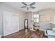 Bonus room featuring hardwood floors, natural light, and modern decor at 521 Mirramont Pl, Woodstock, GA 30189
