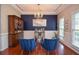 Stylish dining room with hardwood floors, a chandelier, and elegant decor at 521 Mirramont Pl, Woodstock, GA 30189