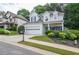 Charming two-story home featuring a two-car garage, well-manicured landscaping, and inviting curb appeal at 521 Mirramont Pl, Woodstock, GA 30189