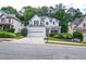 Charming two-story home featuring a two-car garage, well-manicured landscaping, and inviting curb appeal at 521 Mirramont Pl, Woodstock, GA 30189
