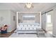 Lovely bedroom featuring a four-poster bed, tray ceiling, and modern finishes at 521 Mirramont Pl, Woodstock, GA 30189