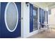 Charming front porch features seating, blue shutters, and an inviting entrance at 521 Mirramont Pl, Woodstock, GA 30189