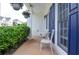 Cozy front porch with seating and hanging plants, perfect for enjoying the outdoors at 521 Mirramont Pl, Woodstock, GA 30189