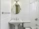 Bright bathroom features white subway tile and an oval mirror at 746 N Highland Ne Ave # 6, Atlanta, GA 30306