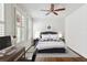 Comfortable bedroom featuring a queen-sized bed, ceiling fan, and plenty of natural light at 746 N Highland Ne Ave # 6, Atlanta, GA 30306