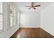Well-lit bedroom with hardwood floors, white shutters, and a ceiling fan at 746 N Highland Ne Ave # 6, Atlanta, GA 30306