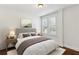 Serene bedroom with a queen-sized bed, natural light, and neutral decor at 746 N Highland Ne Ave # 6, Atlanta, GA 30306