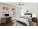 Bedroom with a comfortable bed, workspace, and ample natural light from shuttered windows at 746 N Highland Ne Ave # 6, Atlanta, GA 30306