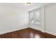 Bright bedroom with hardwood floors and a window with white shutters at 746 N Highland Ne Ave # 6, Atlanta, GA 30306