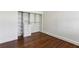 Bedroom closet featuring built in shelving and drawers on top of hardwood floors at 746 N Highland Ne Ave # 6, Atlanta, GA 30306
