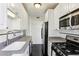 Functional kitchen layout with stainless steel appliances, ample counter space and tiled floor at 746 N Highland Ne Ave # 6, Atlanta, GA 30306