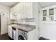 Efficient galley kitchen with stainless steel appliances and ample white cabinet space at 746 N Highland Ne Ave # 6, Atlanta, GA 30306