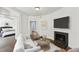 Inviting living room with fireplace and decor, flowing into a bedroom for seamless living at 746 N Highland Ne Ave # 6, Atlanta, GA 30306