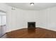 Spacious living room featuring hardwood floors, crown molding, and a cozy fireplace at 746 N Highland Ne Ave # 6, Atlanta, GA 30306