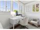 Bright office space with white desk, chair, and large windows offering natural light and a pleasant workspace at 746 N Highland Ne Ave # 6, Atlanta, GA 30306