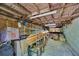 Spacious basement with wooden ceiling beams offering ample storage and workspace at 934 Pine Cir, Woodstock, GA 30189