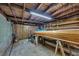 Large basement offering ample storage and project space with a rustic wooden ceiling at 934 Pine Cir, Woodstock, GA 30189