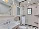 Contemporary bathroom with tiled shower, pedestal sink, and a modern design at 934 Pine Cir, Woodstock, GA 30189