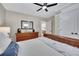 Bedroom with hardwood floors, dresser, and a view into the hallway and other rooms at 934 Pine Cir, Woodstock, GA 30189