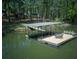 Large dock over the water with seating and boat parking at 934 Pine Cir, Woodstock, GA 30189
