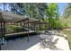 Spacious dock with boat slip, dining table, and seating, great for lakeside entertainment at 934 Pine Cir, Woodstock, GA 30189