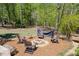 Backyard fire pit area with Adirondack chairs, creating a cozy outdoor space for relaxation at 934 Pine Cir, Woodstock, GA 30189