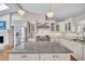 Spacious kitchen featuring a center island, stainless steel appliances, and a vaulted ceiling at 934 Pine Cir, Woodstock, GA 30189
