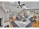 Open floor plan view of the living room and kitchen area with skylights and a fireplace at 934 Pine Cir, Woodstock, GA 30189
