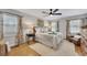 Inviting bedroom with floral curtains, a ceiling fan, and a cozy area rug at 934 Pine Cir, Woodstock, GA 30189