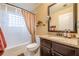 Bathroom featuring a vanity with a granite countertop, toilet, and shower with a privacy window at 1745 Mary Lou Ln, Atlanta, GA 30316