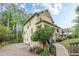 Charming two-story home with a covered porch, landscaped yard, and driveway at 1745 Mary Lou Ln, Atlanta, GA 30316