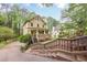 Lovely two-story home featuring a covered front porch and meticulous landscaping at 1745 Mary Lou Ln, Atlanta, GA 30316