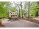 A beautiful, well-maintained home is partially visible beyond the treeline at 1745 Mary Lou Ln, Atlanta, GA 30316