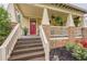 Inviting front porch with stone accents, a ceiling fan, and charming decor at 1745 Mary Lou Ln, Atlanta, GA 30316