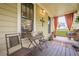 Cozy front porch featuring a swinging bench, comfortable seating, and rustic decor at 1745 Mary Lou Ln, Atlanta, GA 30316