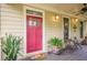 Welcoming front porch with a bright red door, plants, and cozy seating area at 1745 Mary Lou Ln, Atlanta, GA 30316