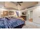 Comfortable main bedroom features plush carpet, a ceiling fan, and access to the ensuite bathroom at 1745 Mary Lou Ln, Atlanta, GA 30316