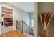 View of an upstairs staircase with wooden steps, an iron banister, and hardwood flooring at 1745 Mary Lou Ln, Atlanta, GA 30316