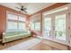 Bright sunroom with large windows, comfortable seating, and access to a screened-in porch at 1745 Mary Lou Ln, Atlanta, GA 30316