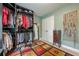 Walk-in closet with shelves for hats, clothes, shoes, full mirror, and an area for jewelry at 1745 Mary Lou Ln, Atlanta, GA 30316