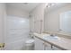 This bathroom features a shower-tub combination, sink with vanity, and a window providing natural light at 2550 Columbia Crossing Ct, Decatur, GA 30034